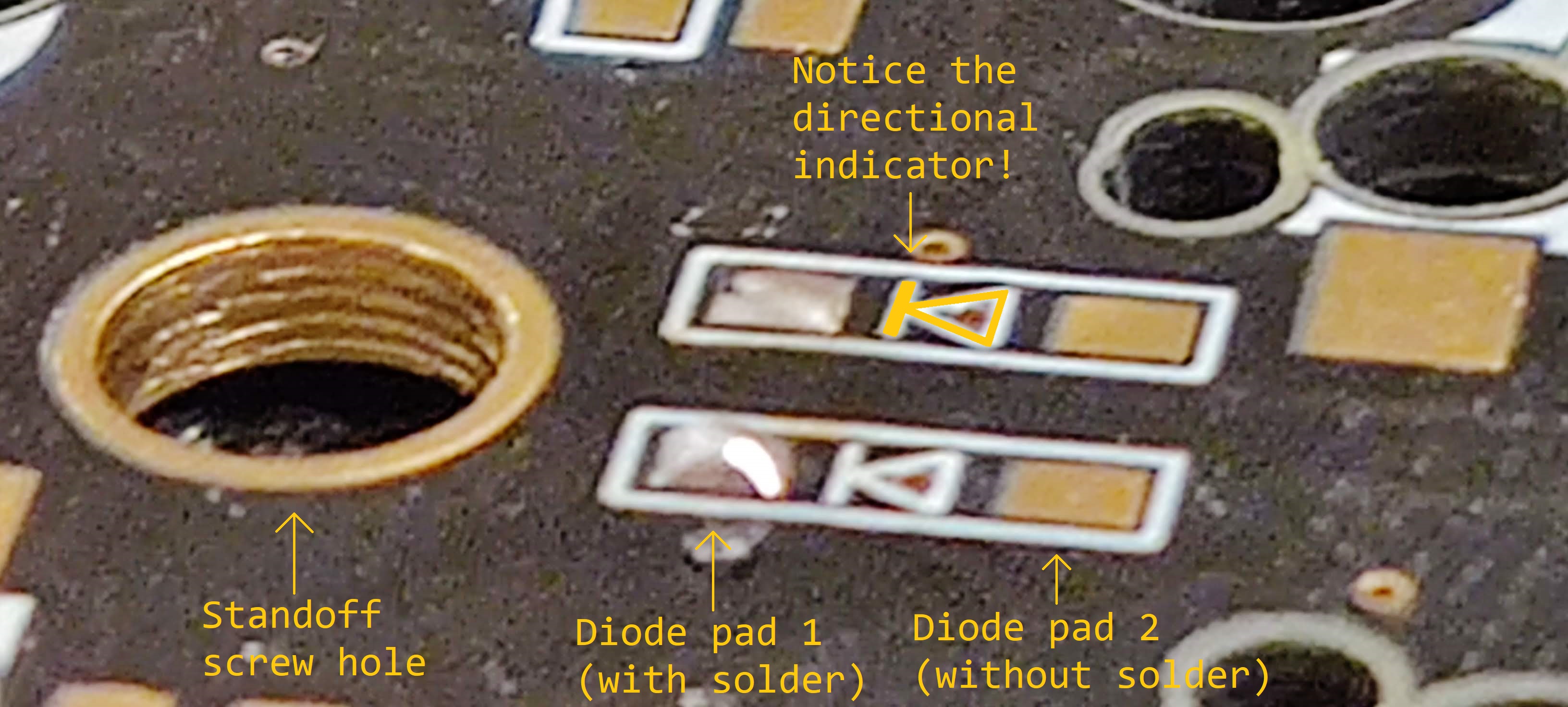 The left-hand pads on these two diode spots have a small amount of solder on them